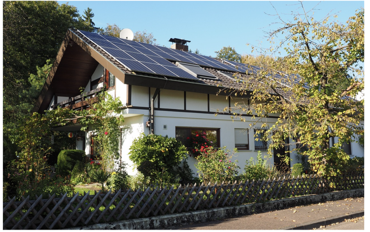 beautiful house with solar panels installed on the roof