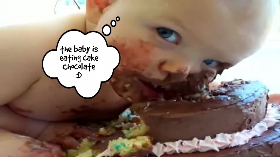 the baby is eating cake Chocolate :D  | phrase.it